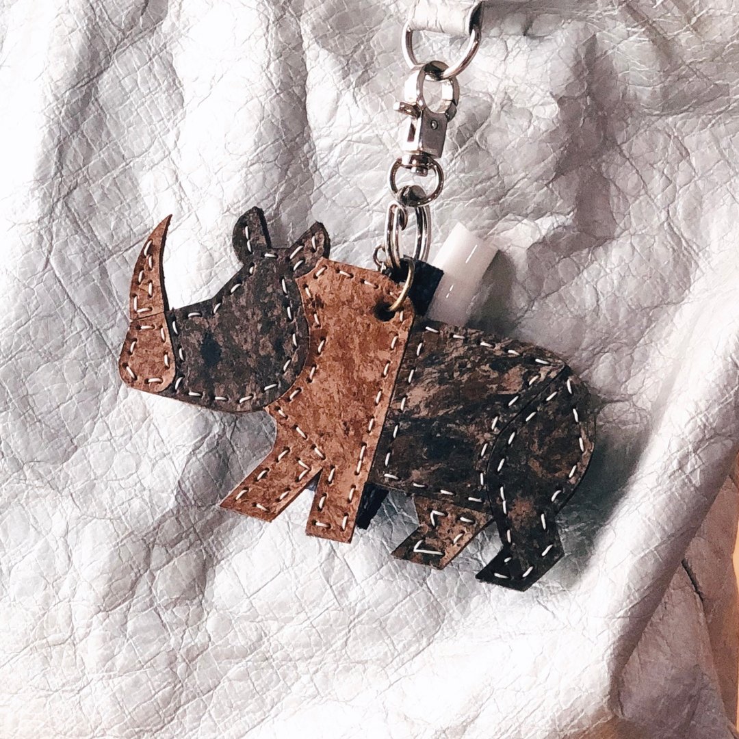 Handcrafted RHINO bag charm from 100% recycled leather + alcohol spray case - 吊饰 - 环保材料 多色