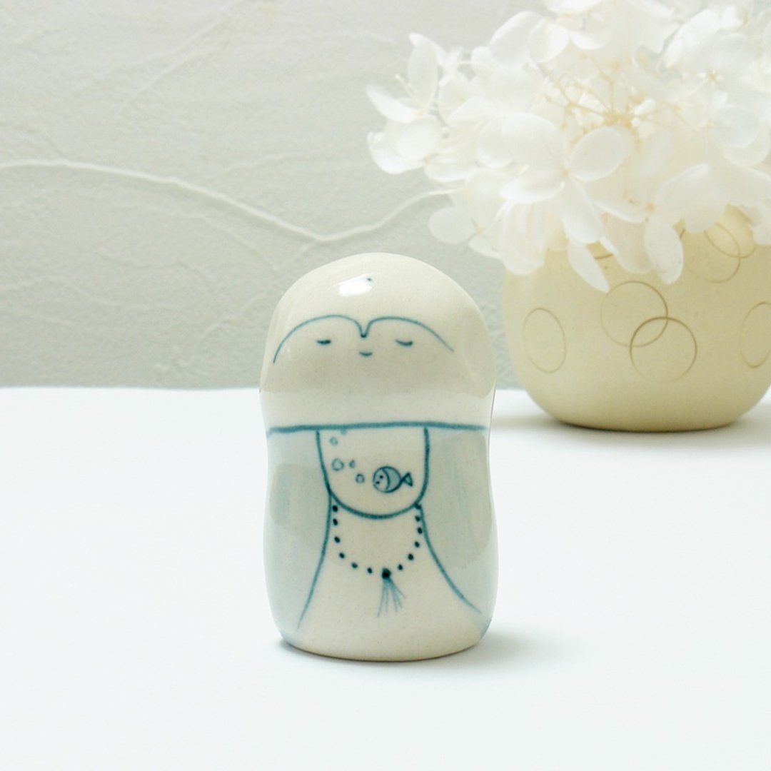 Handmade ceramic doll Jizo with a fish apron - 摆饰 - 瓷 白色