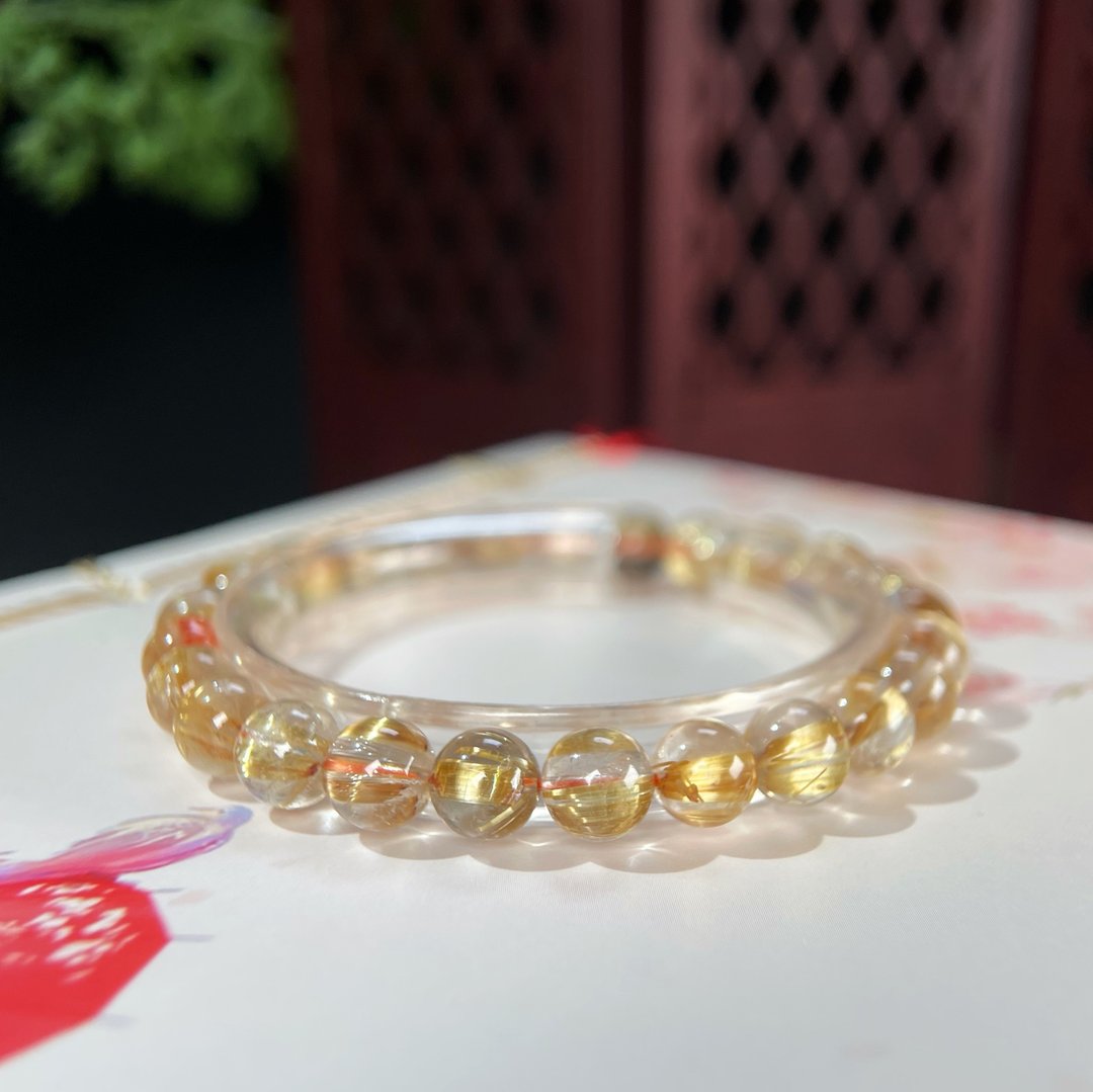 冰透金钛晶圆珠手钏 顺发猫眼金红石水晶手錬 金光璀璨 富贵吉祥 - 手链/手环 - 水晶 金色