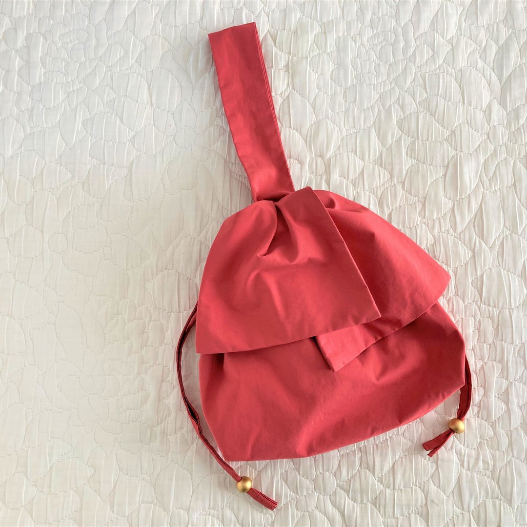Water repellent taffeta big ribbon one handle drawstring mini bag coral orange - 手提包/手提袋 - 其他材质 橘色